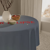 Round tablecloth with red text reading "R" and "LIPSE" on a table.