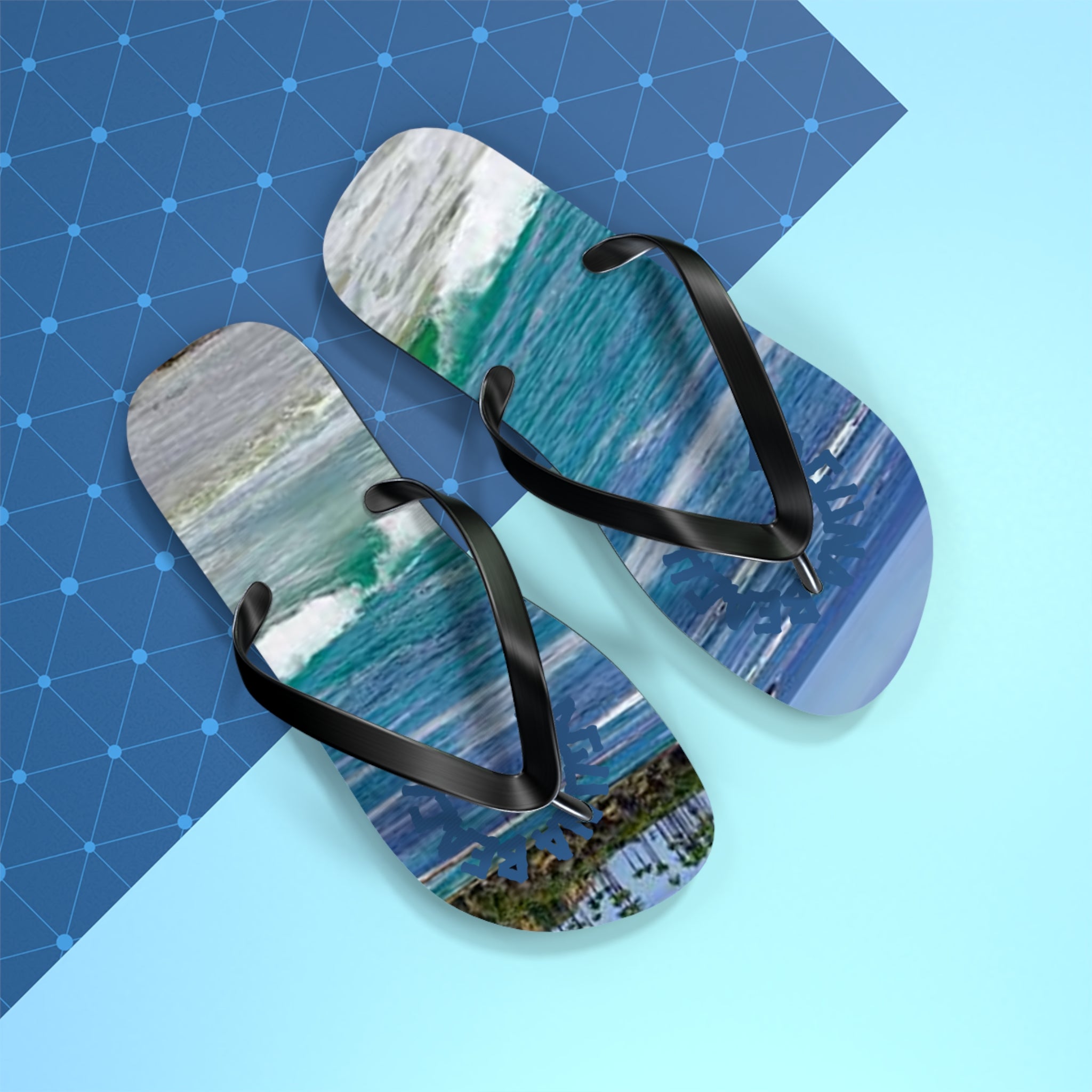 Flip-flops with a tropical beach and ocean wave print.