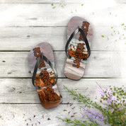 Flip-flops with "Laguna Beach" text and ocean landscape on wooden planks.