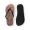 Flip-flops with pink flower pattern and black straps, white background.