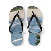 Flip-flops with a beach and ocean wave design.