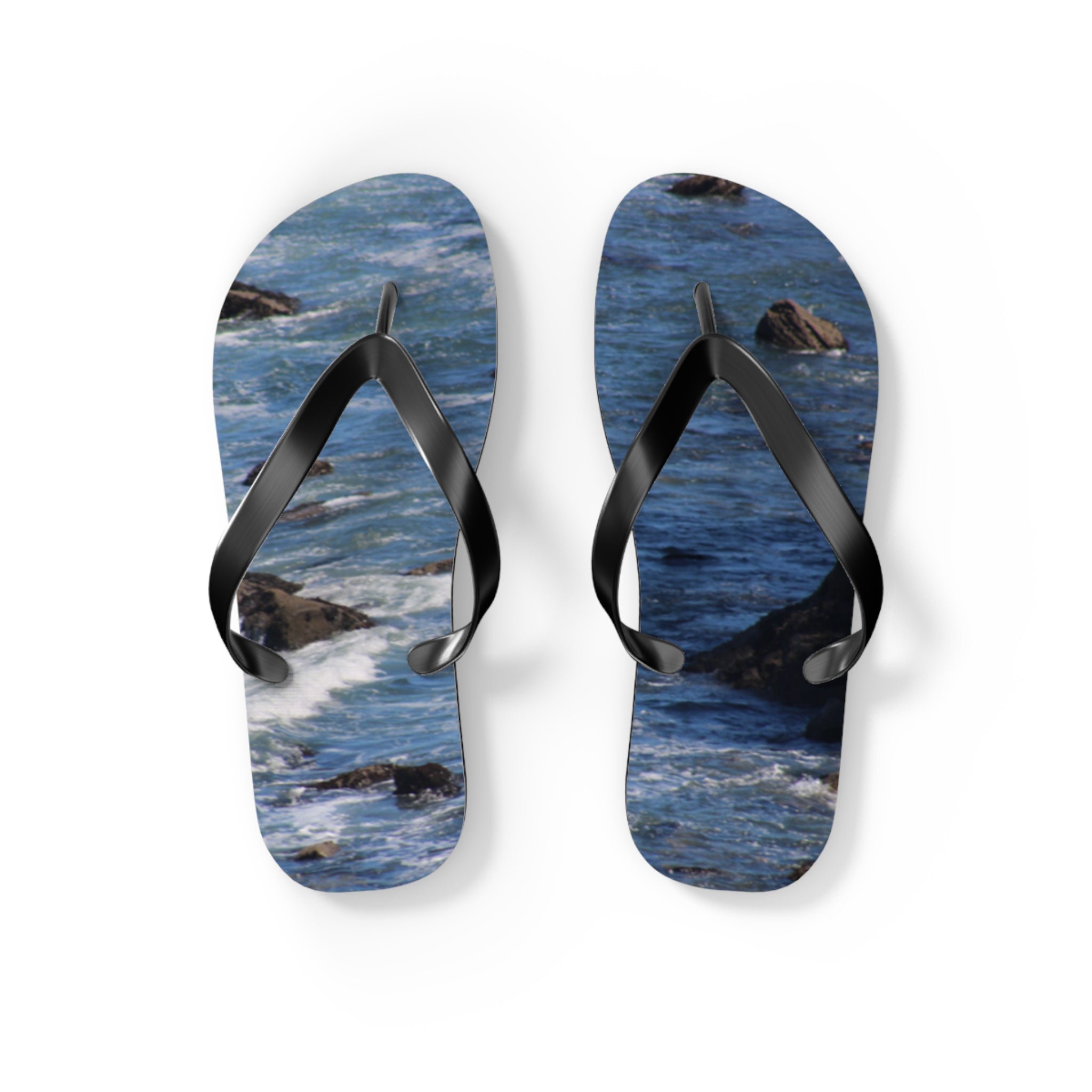 Flip-flops with a blue ocean wave pattern on a white background.