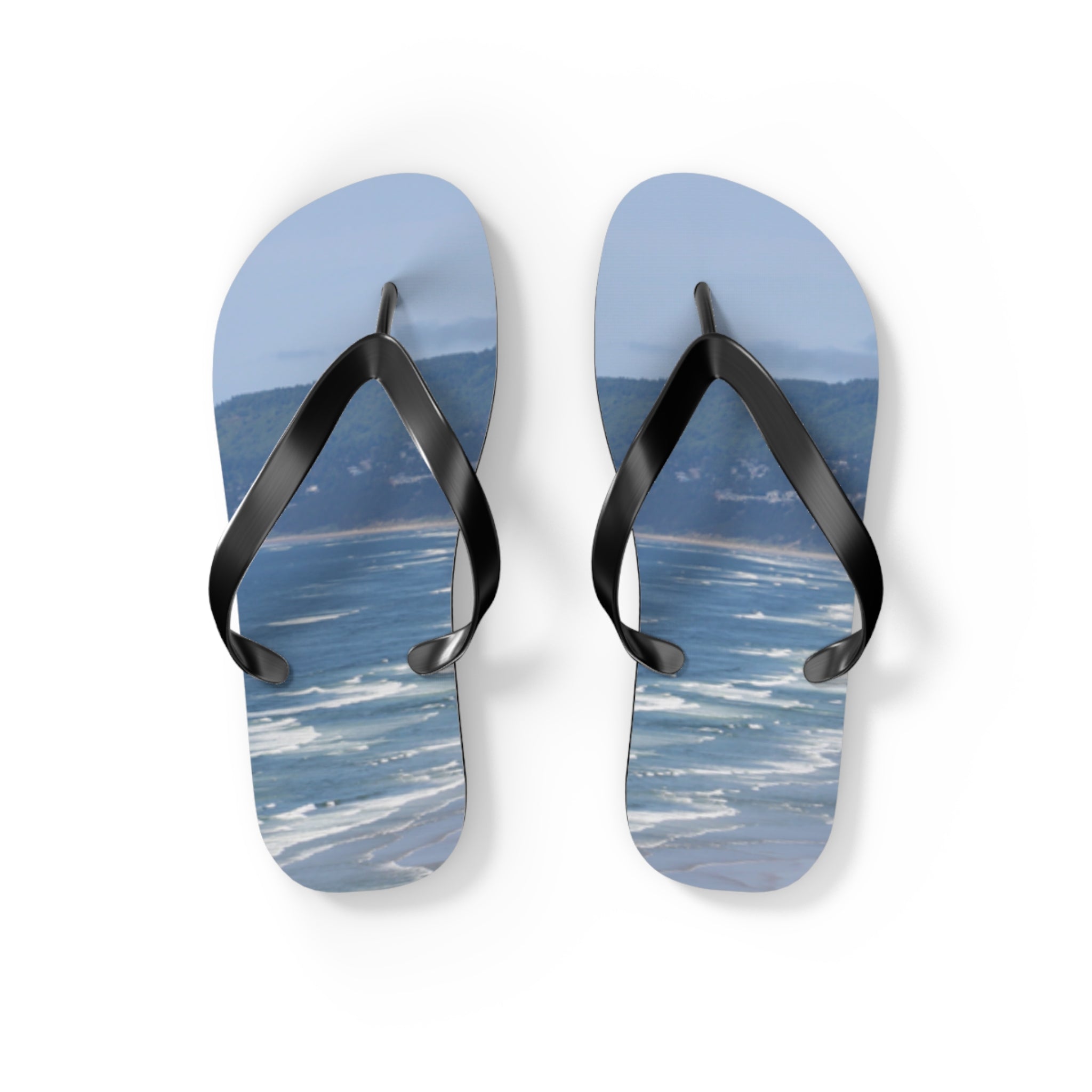 Flip-flops displaying a beach and ocean scene.