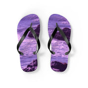 Purple flip-flops with a rocky beach and water pattern.