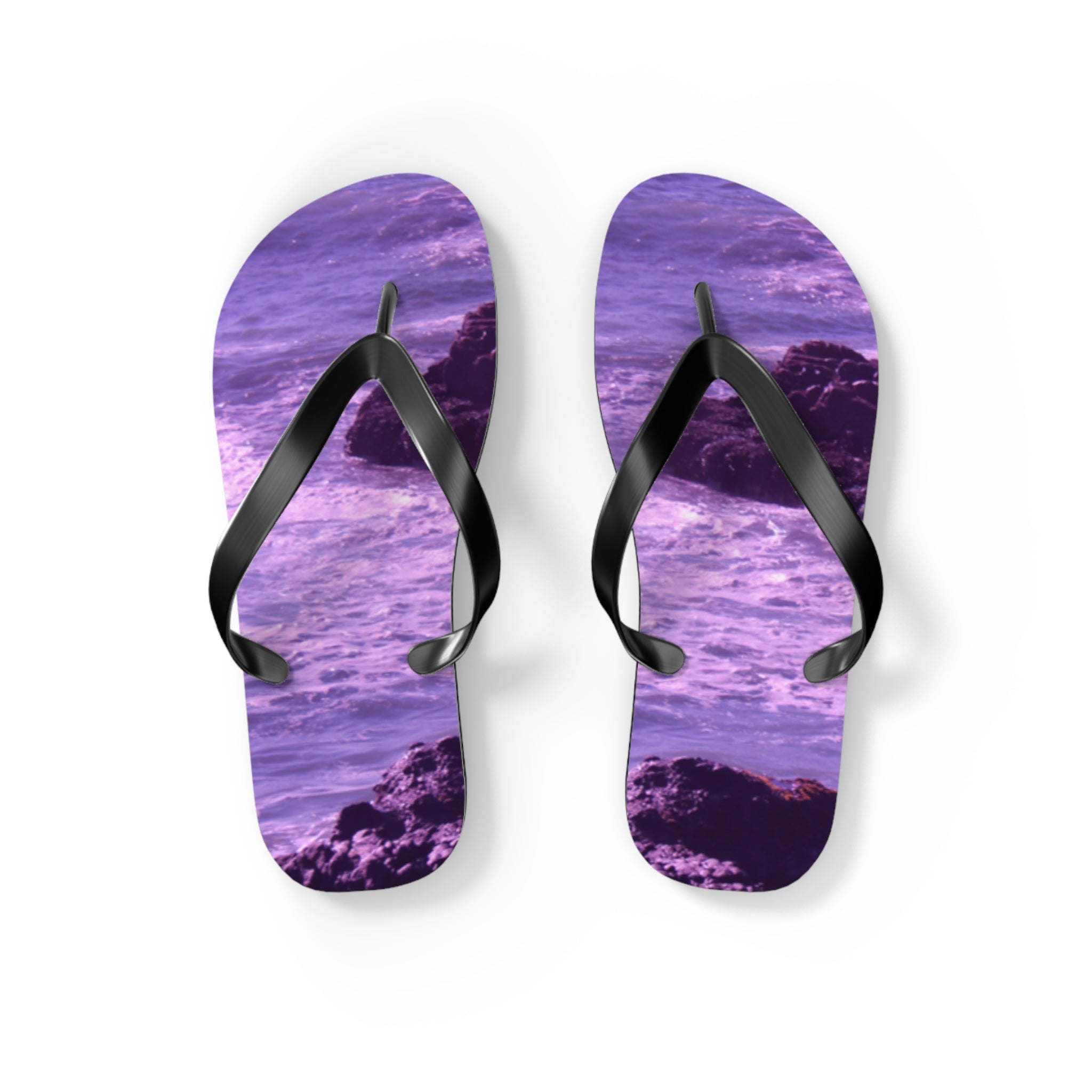 Purple flip-flops with a rocky beach and water pattern.