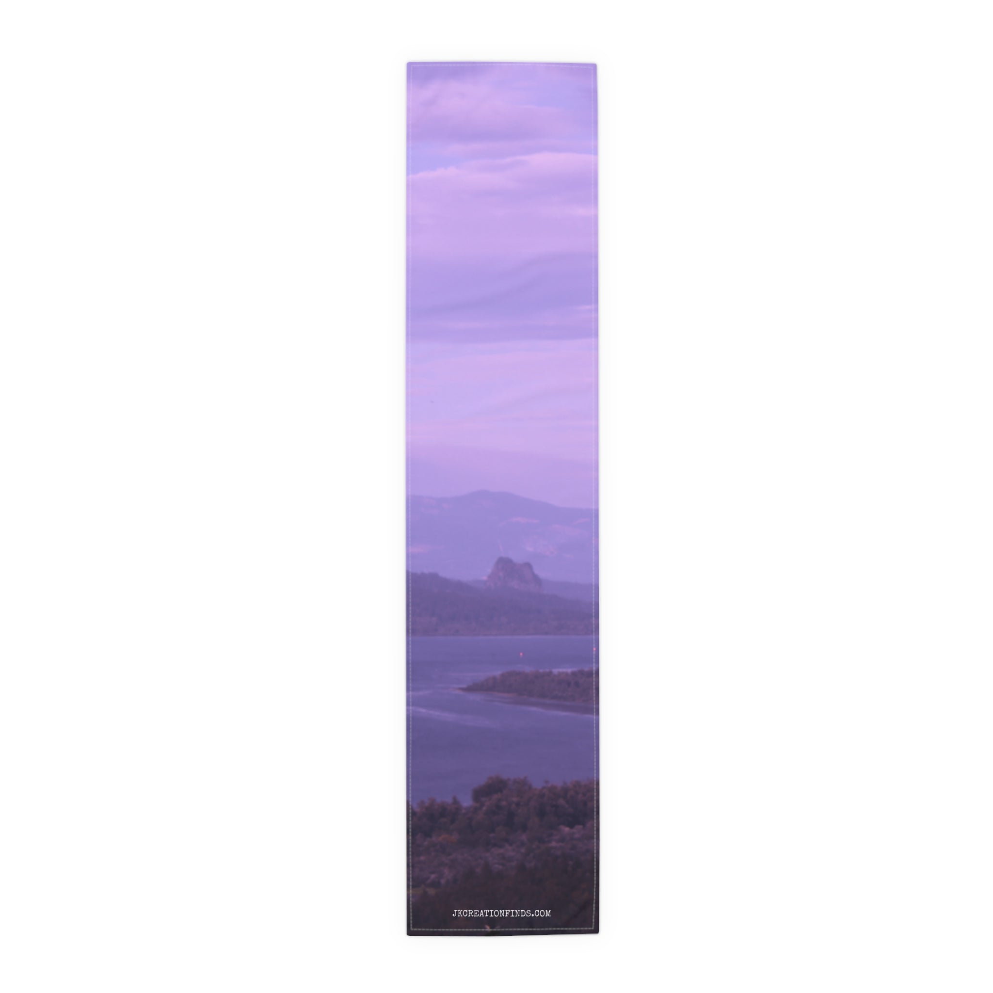 Lavender sky over water and distant hills, with "JEQREATIONFINDS.COM" text.