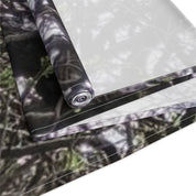 Rolled fabric with a blurred camouflage pattern.