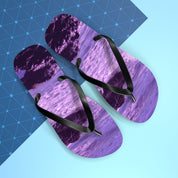 Purple flip-flops with a wave pattern on a blue patterned background.