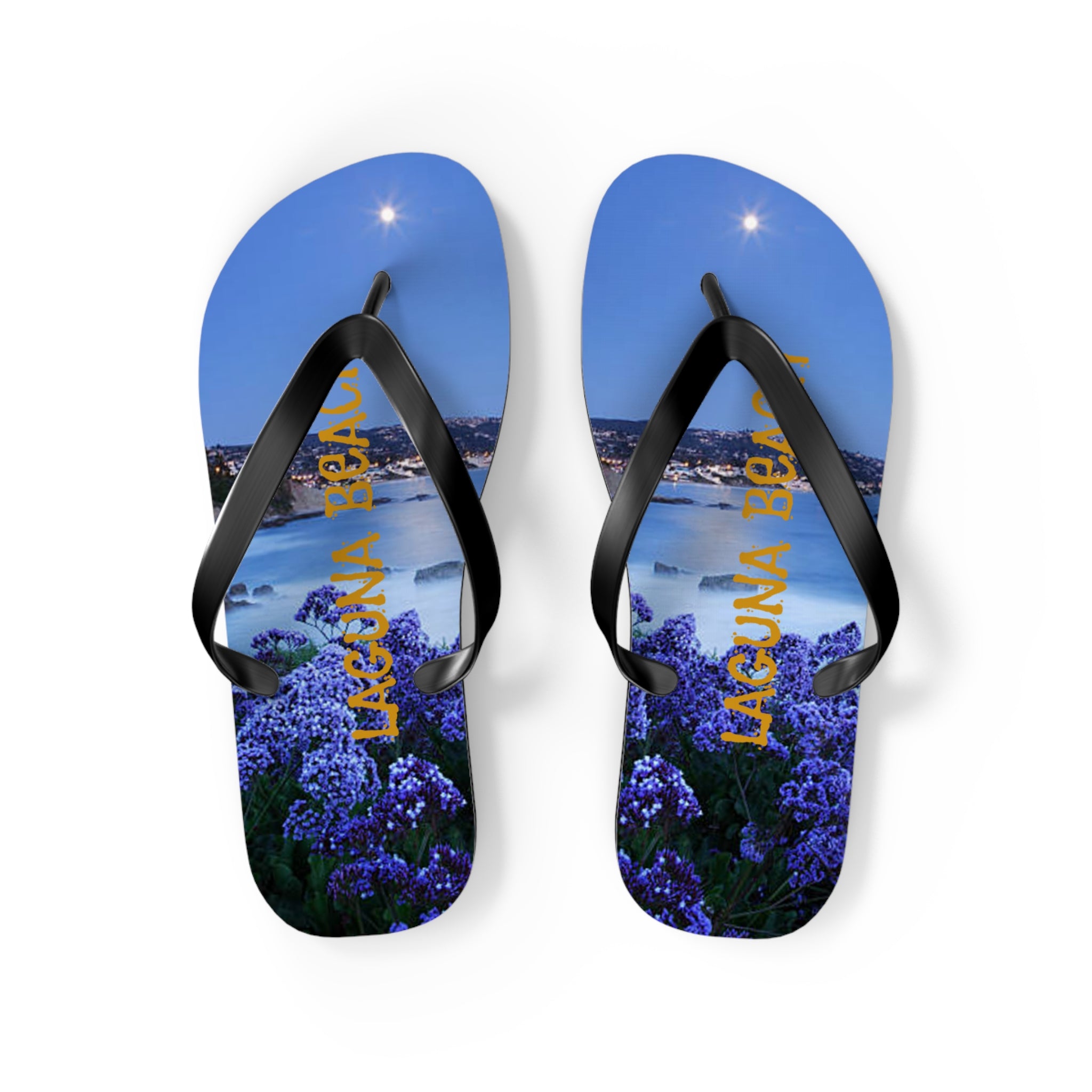 Flip flops with a nighttime view of Laguna Beach and illuminated text.