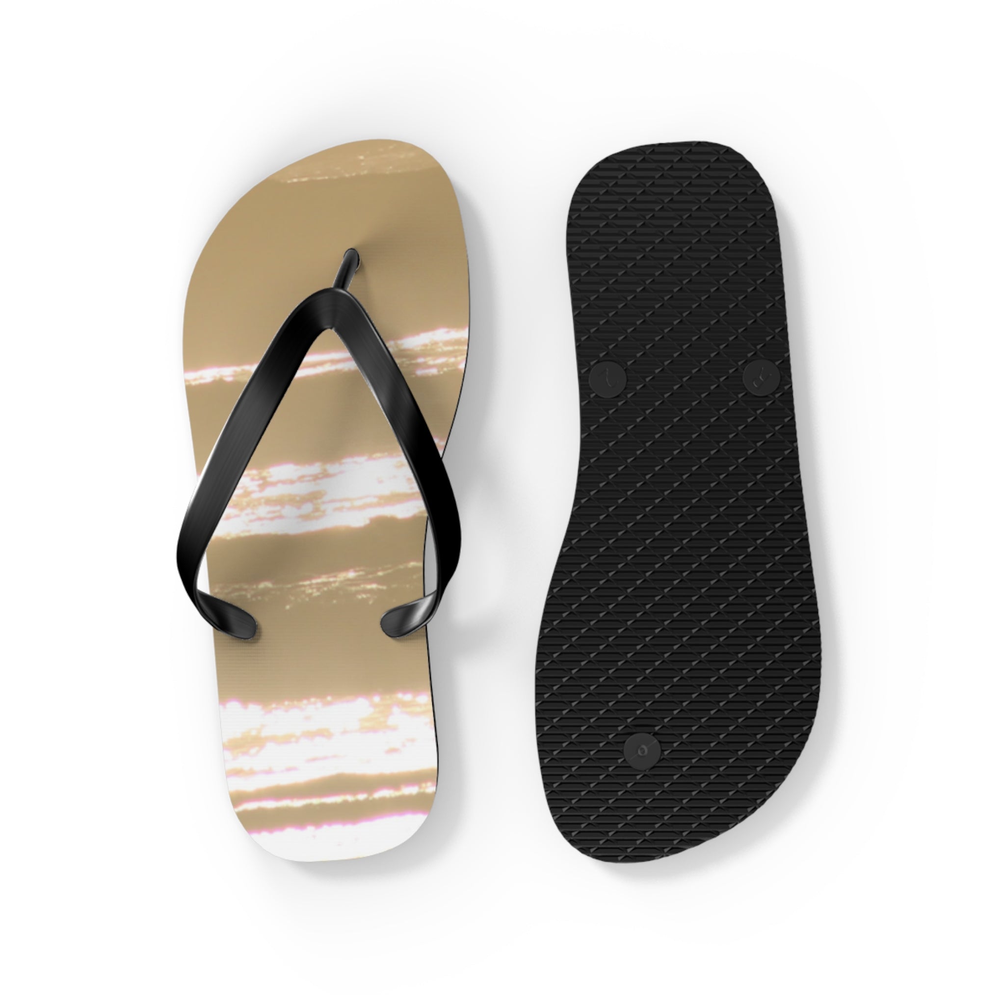 Flip flops with a tan and white striped pattern and black straps.