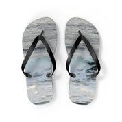 Pair of flip-flops with a realistic ocean wave design.