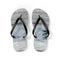 Pair of flip-flops with a realistic ocean wave design.
