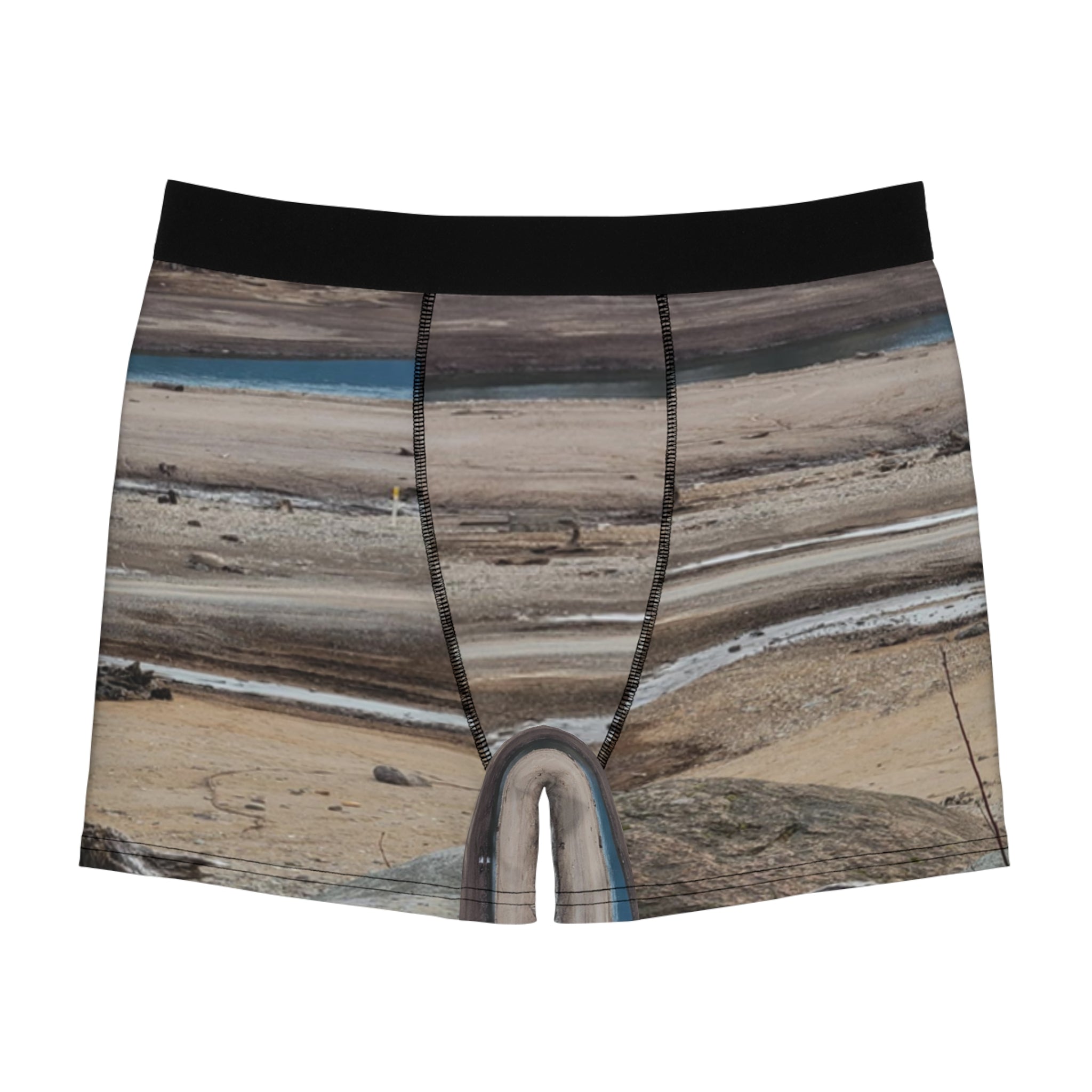Men's boxer briefs with a landscape print of dry, cracked earth and a blue body of water.