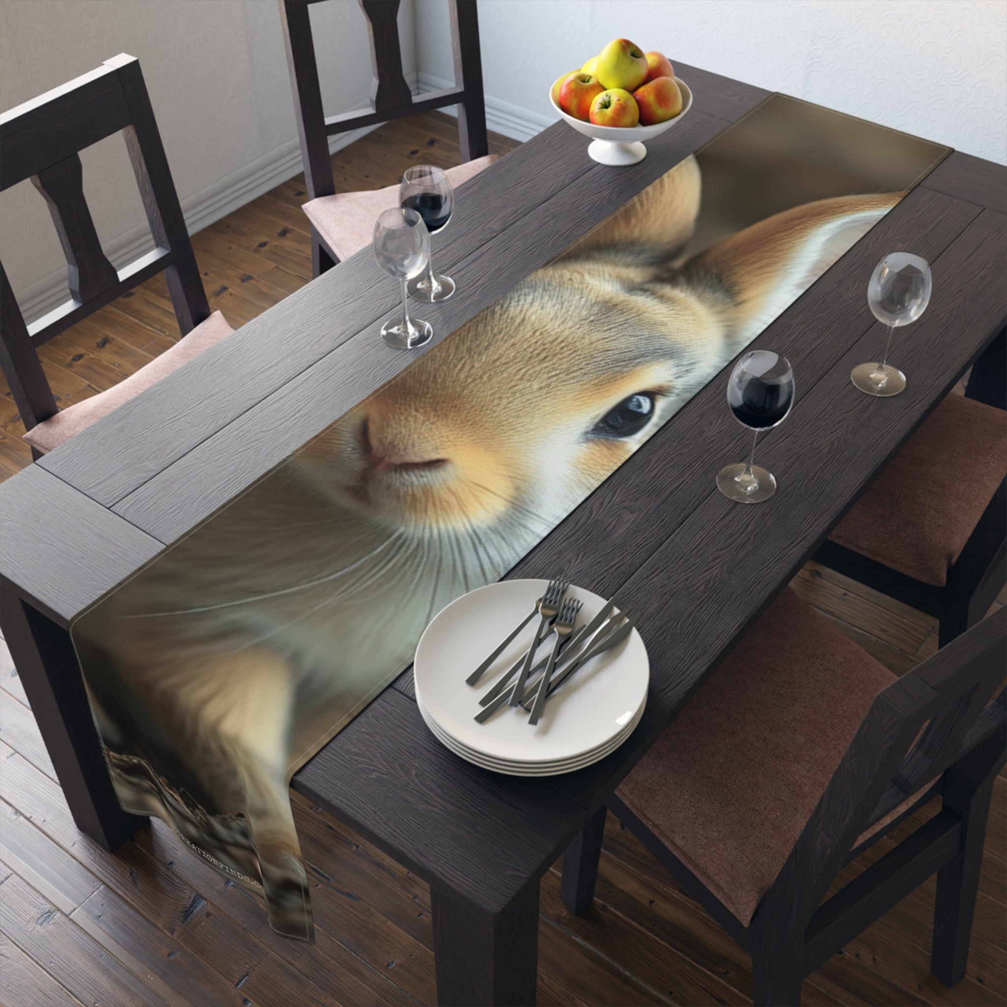 Close-up of a rabbit's face peeking over a table runner.