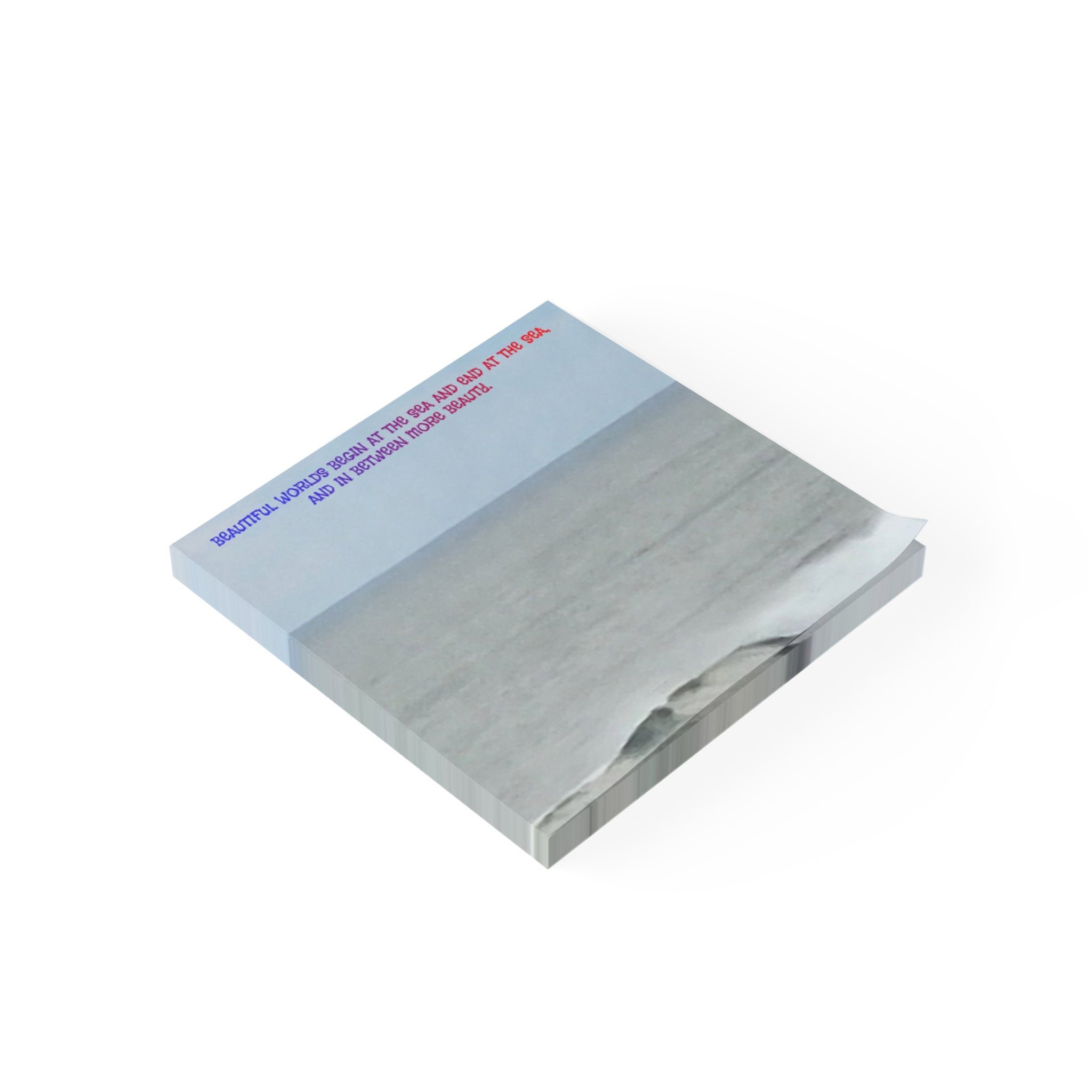 Sticky note with text about the sea, showing a calm ocean scene.