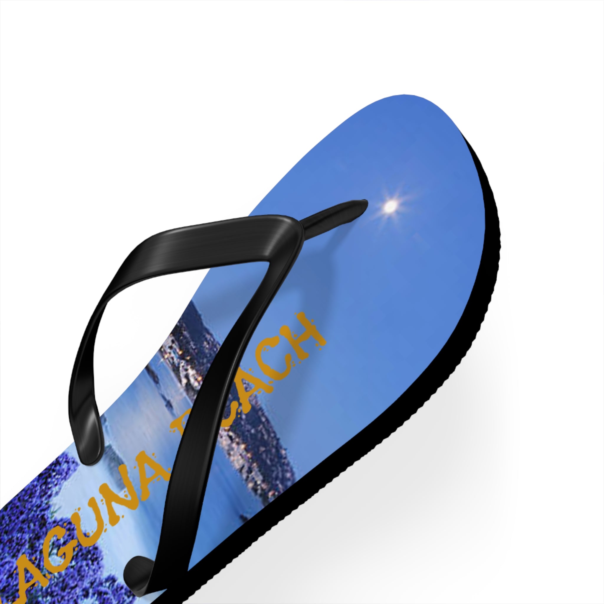 Flip-flop with "Laguna Beach" text and sunny coastal landscape design.