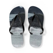 Flip-flops with a black strap and a scenic landscape design.