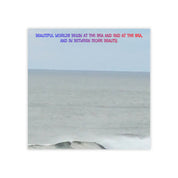 Quote about the sea and beauty over a calm ocean landscape.