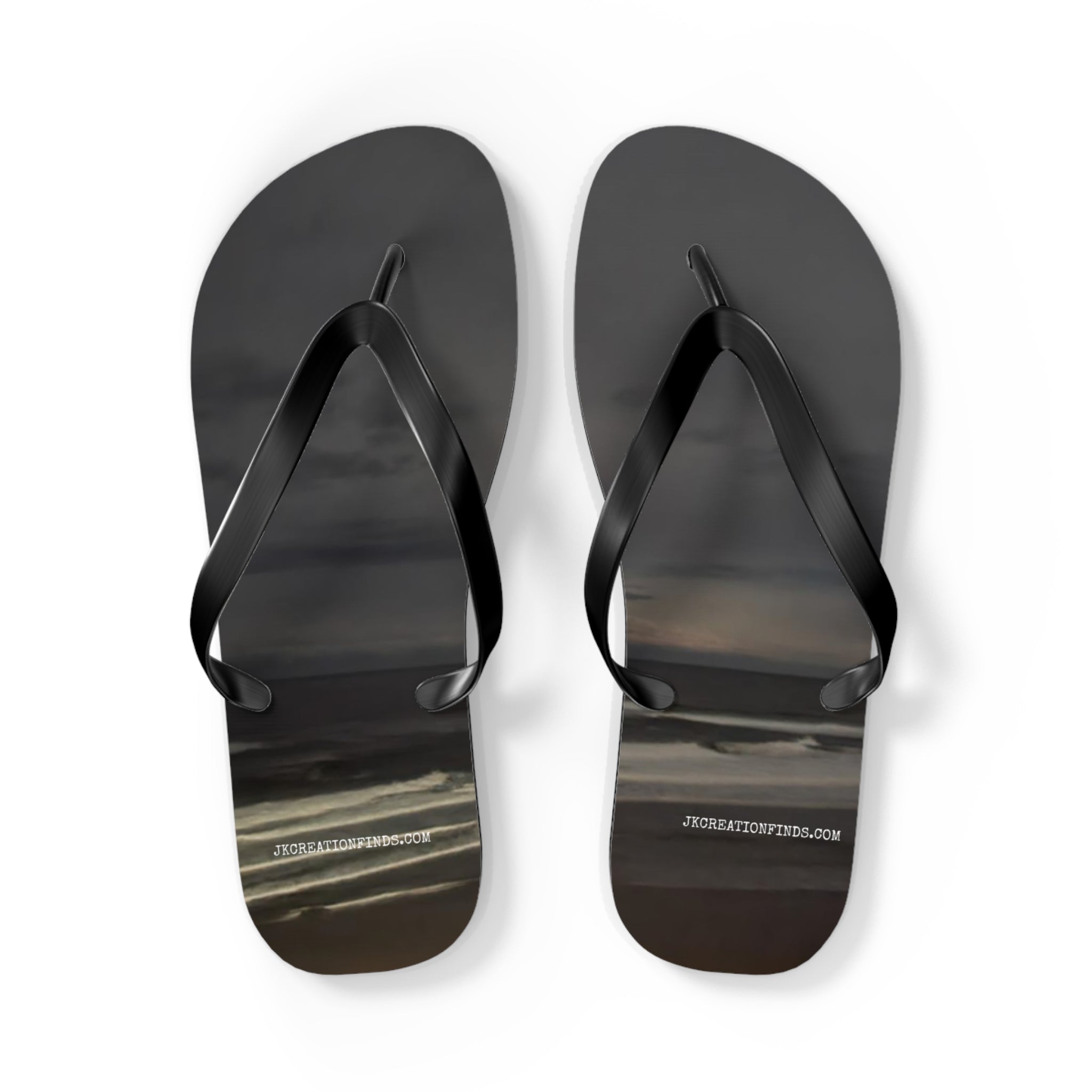 Black flip-flops with a cloudy sky design and jkcreationfinds.com.