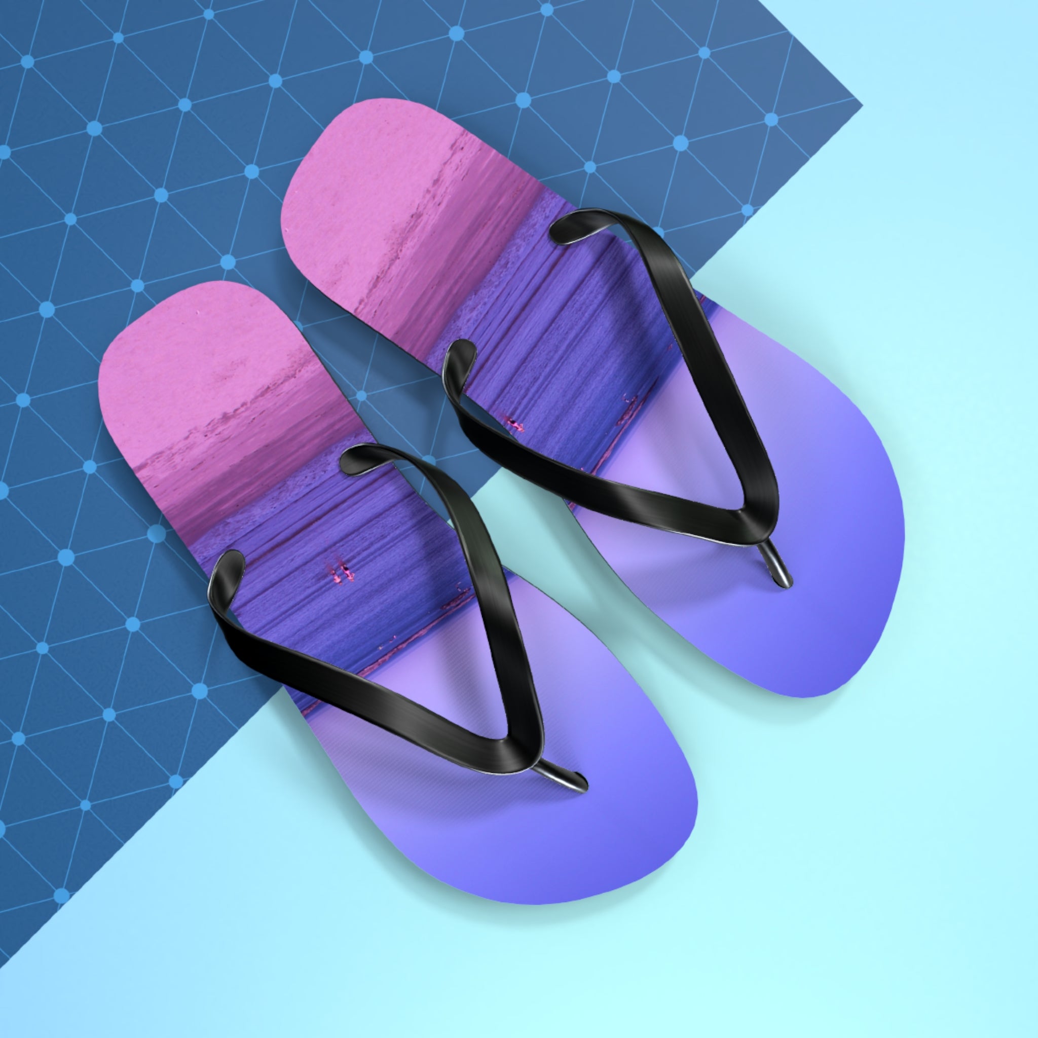Purple and pink gradient flip-flops with a beach scene on the soles.