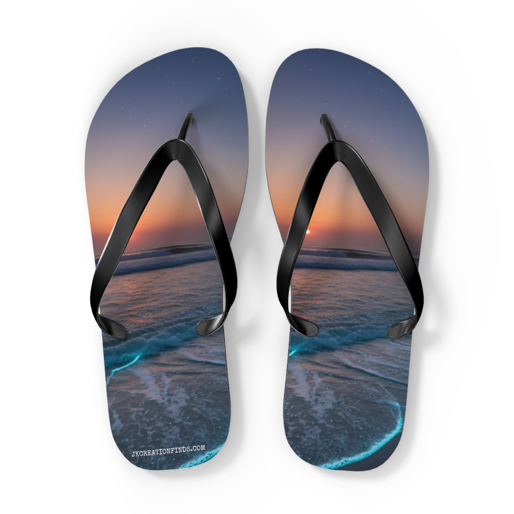Flip-flops with a sunset beach scene and glowing ocean waves.