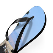 Black flip-flop with a landscape scene on the sole.