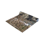 Rolled yoga mat with a natural landscape and "JKCREATIONFINDS.COM" text.