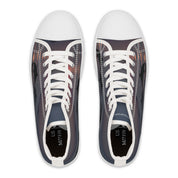 High-top sneakers with a sunset over water landscape printed on them.