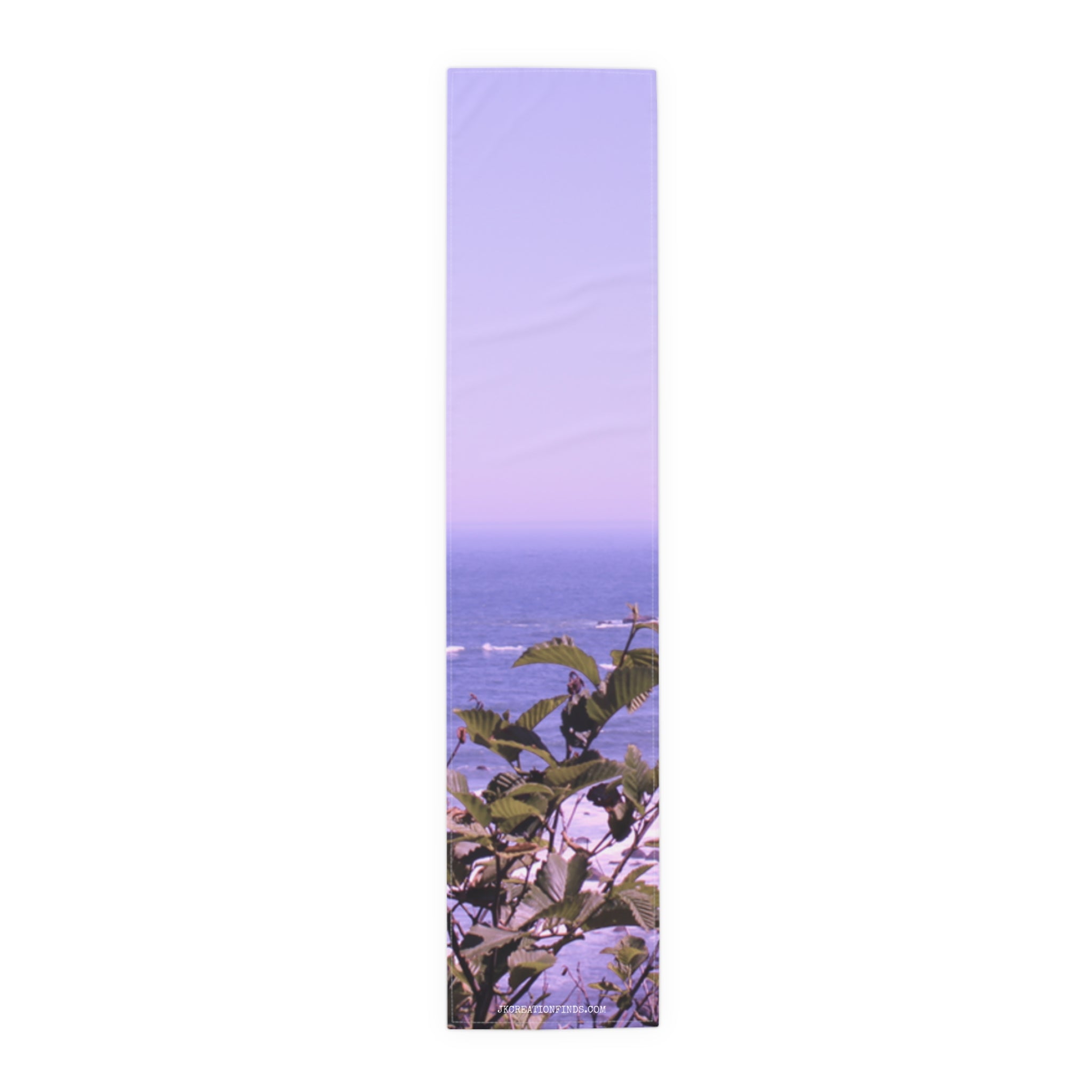 Lavender gradient scarf with ocean and green leaves detail.