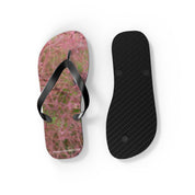Flip-flops with a pink floral pattern and a black sole.