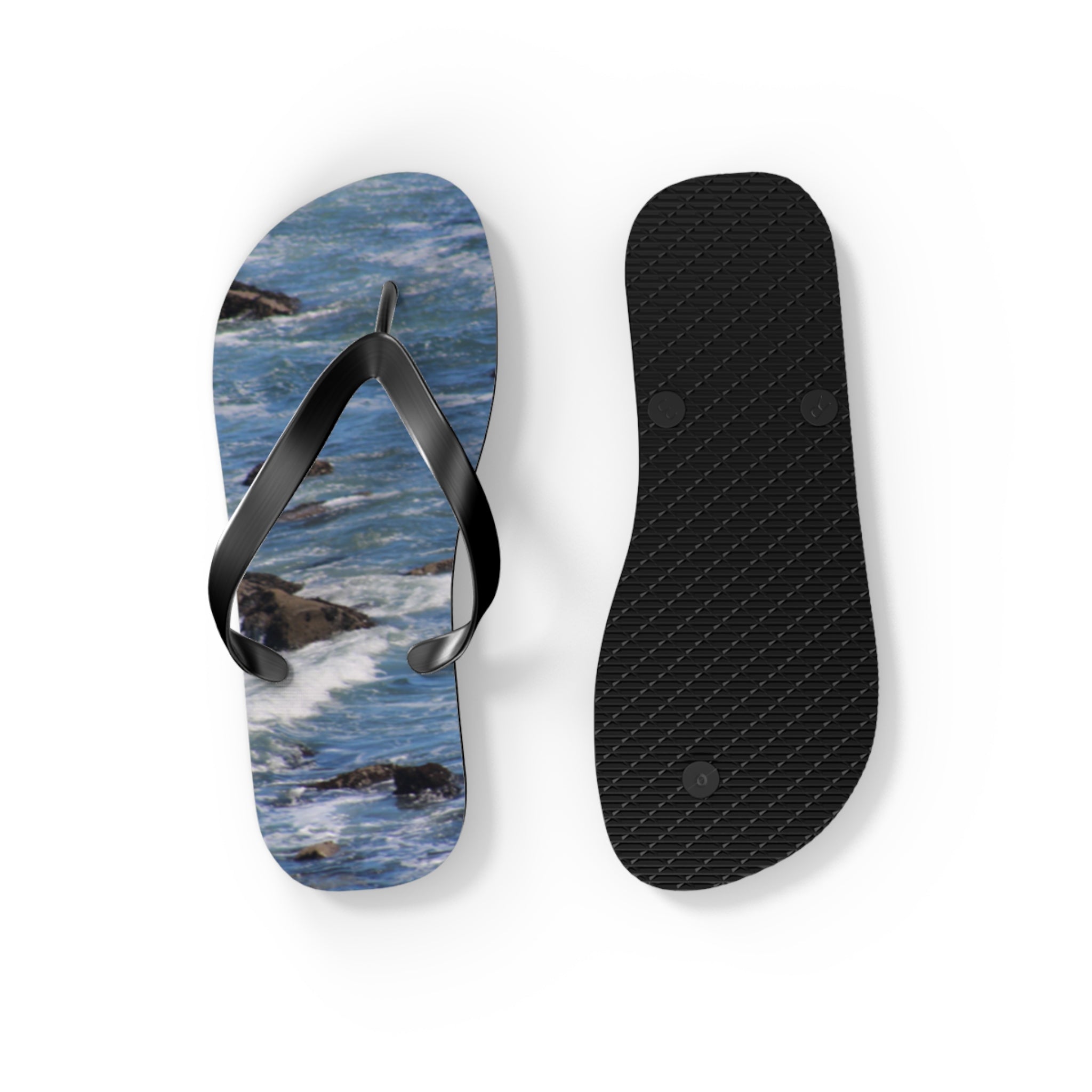 Flip-flops with ocean waves design, one showing the top, one showing the sole.