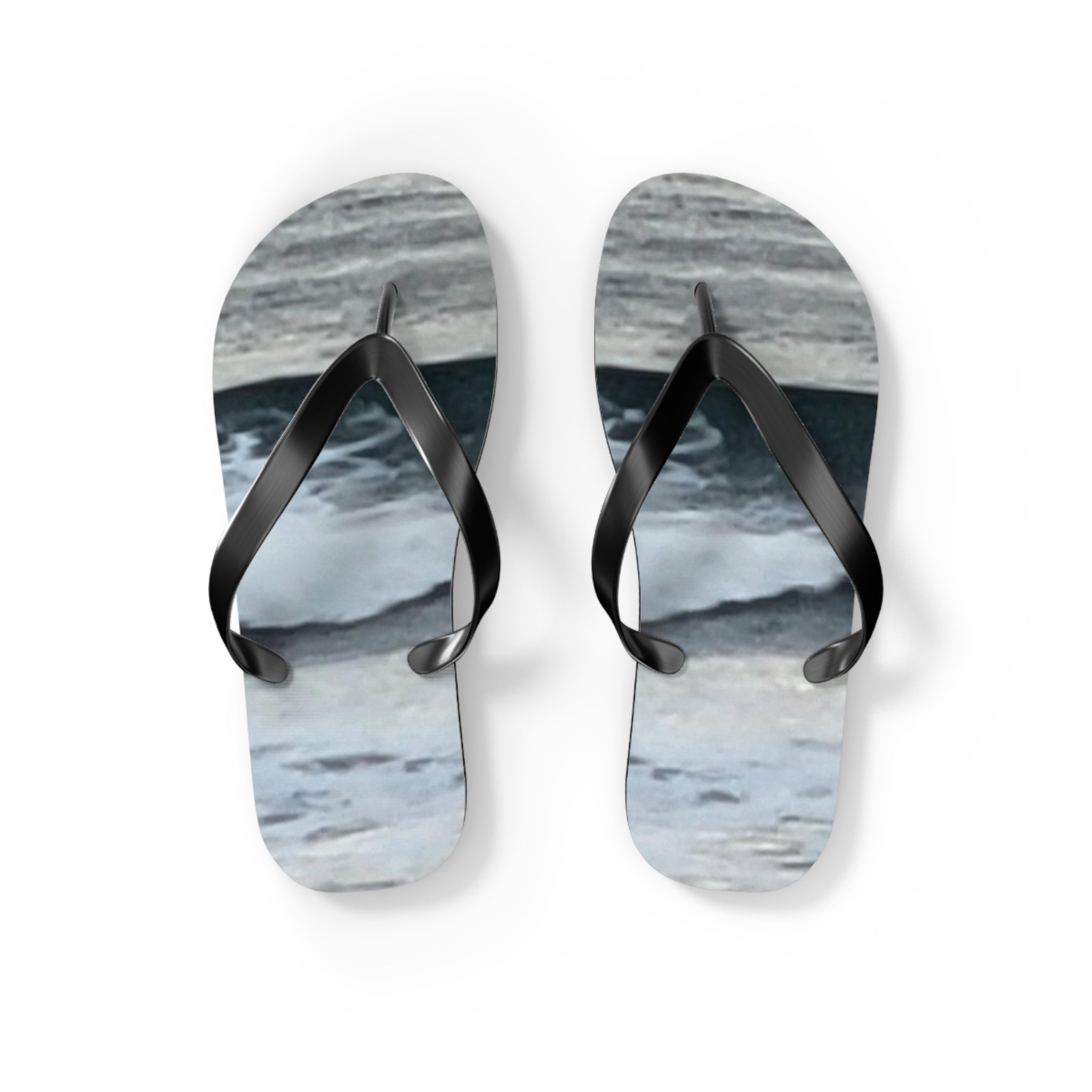 Black flip-flops with a wavy blue and gray sole pattern.