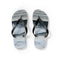 Black flip-flops with a wavy blue and gray sole pattern.