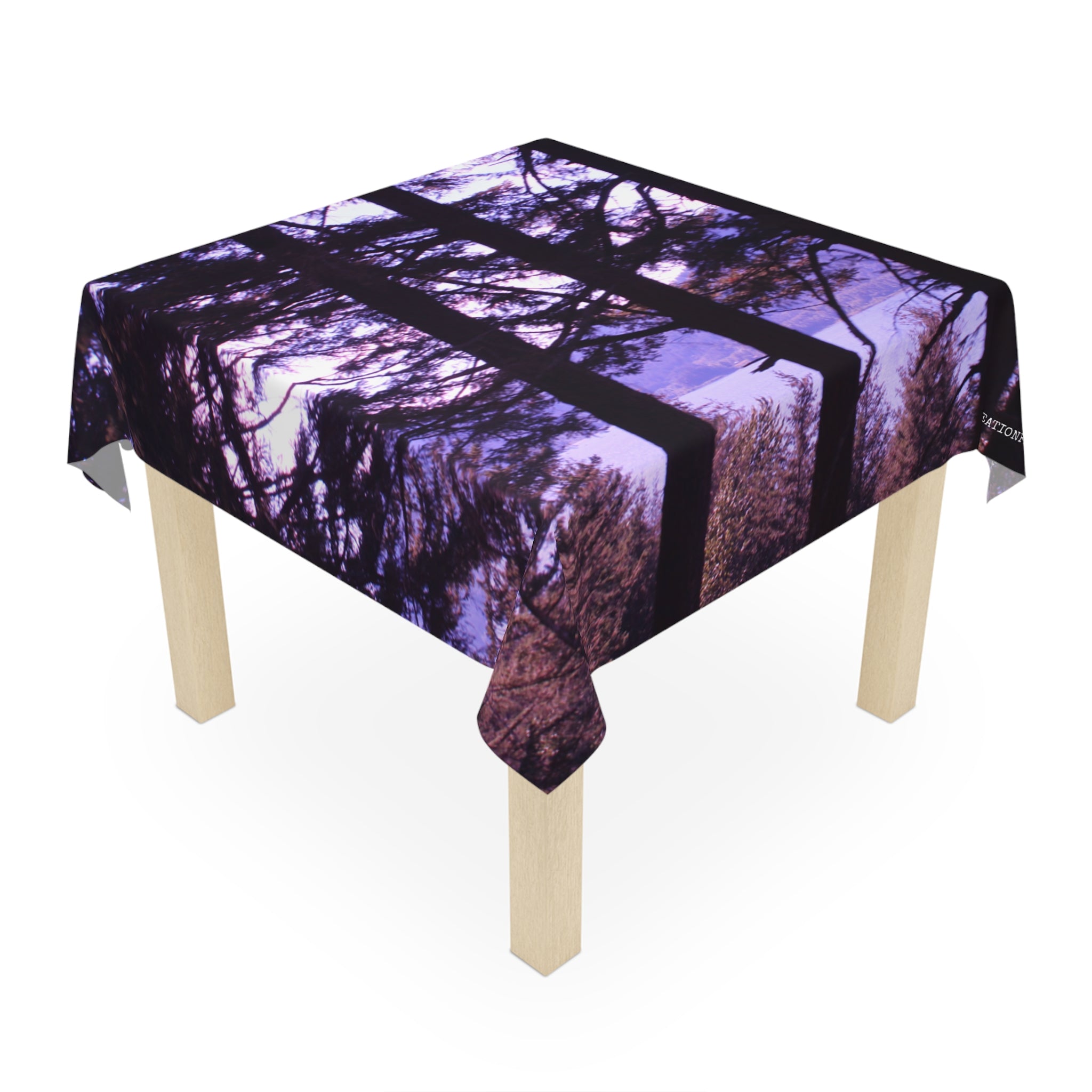 Tablecloth with a dark forest canopy pattern.