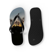 Flip-flops with sunset trees on the left, black sole on the right.