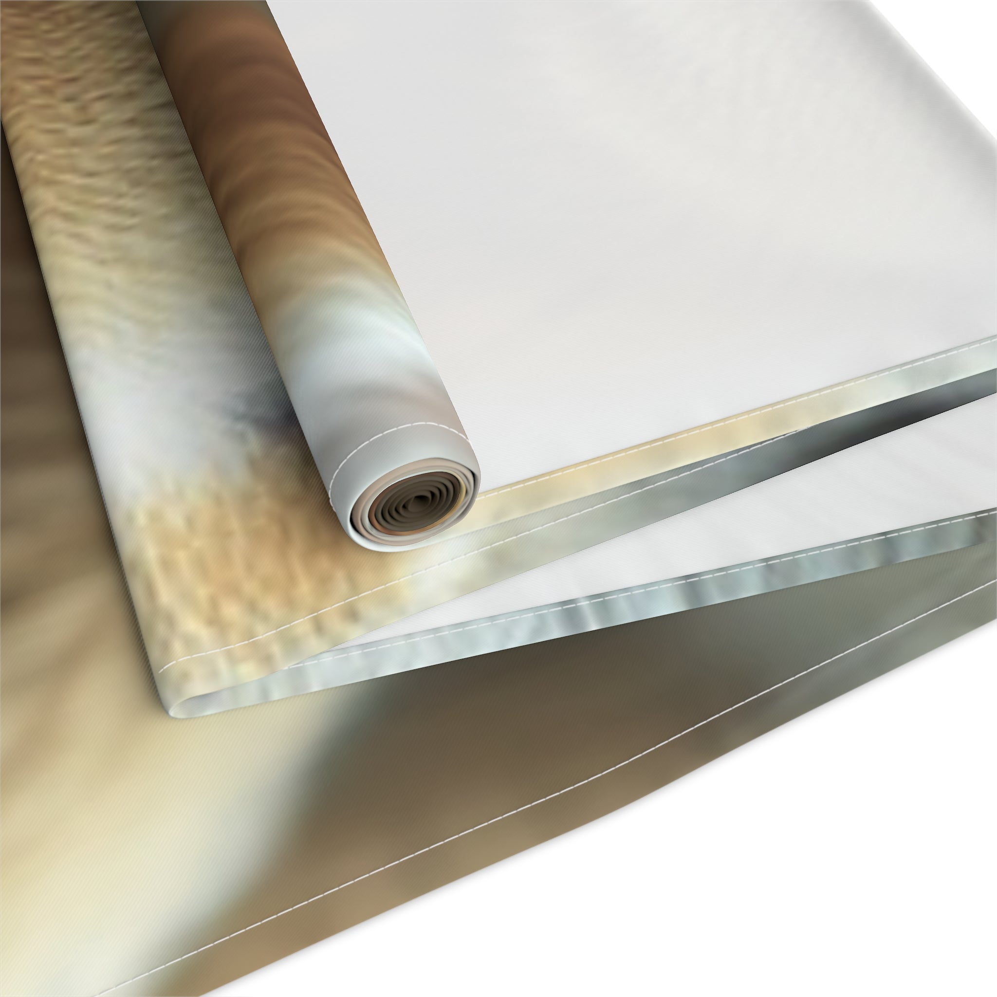 Rolled fabric with a close-up animal print texture on a white background.
