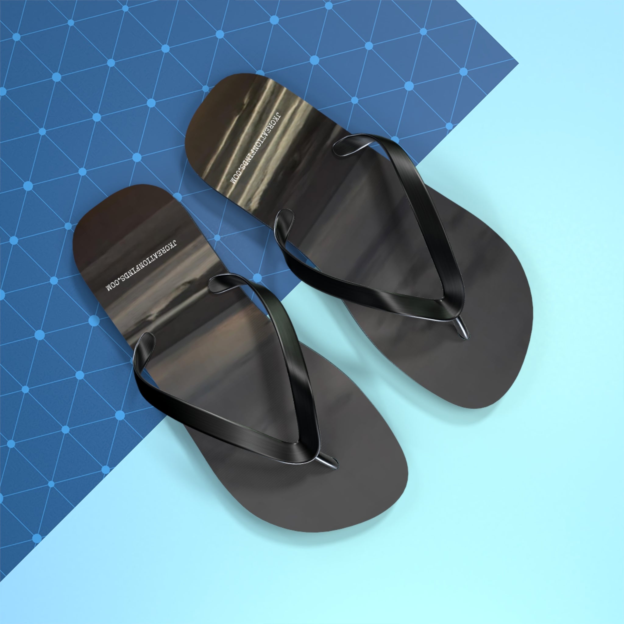 Black flip-flops with a white criss-cross pattern background.
