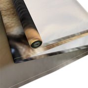 Rolled fabric with close-up of animal fur and blurred background.