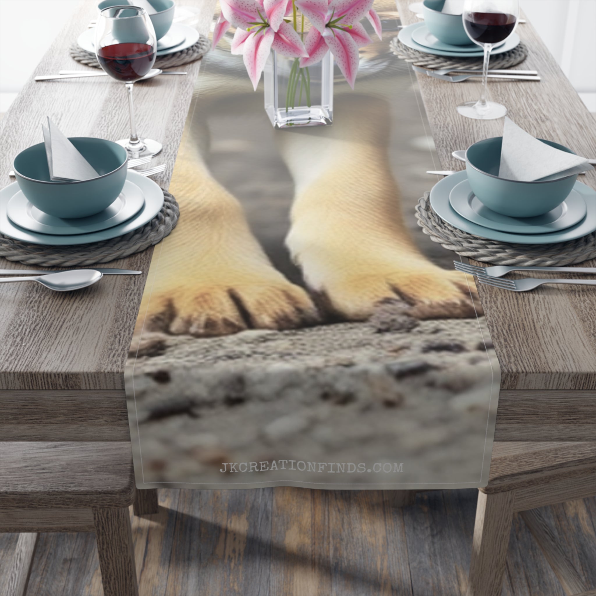 Dog paws resting on a table runner with "JKCREATIONFINDS.COM" text.