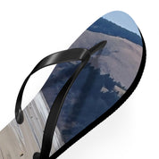 Flip-flop with scenic mountainous landscape on the sole.