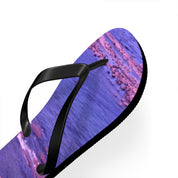 Flip-flop with purple and pink abstract wavy pattern on white background.