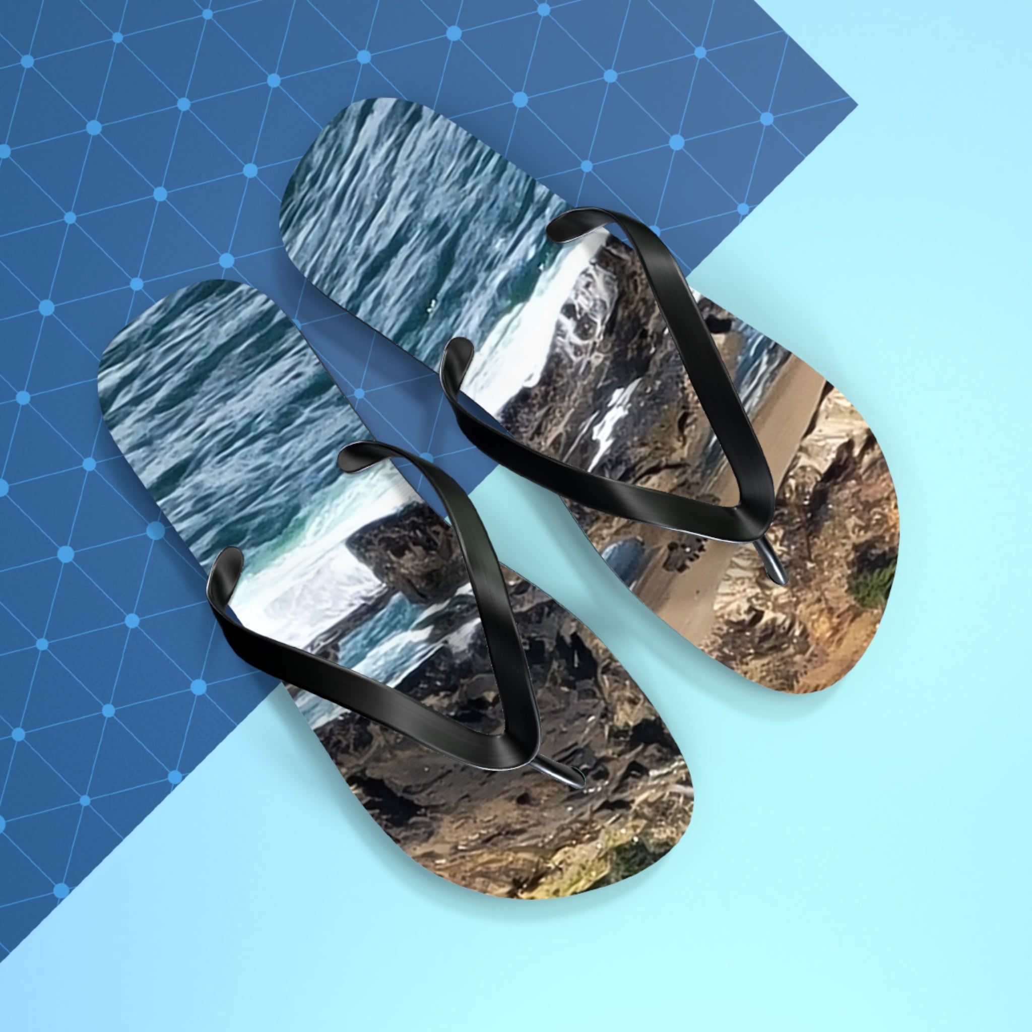 Flip-flops with a rocky coastline and ocean waves print.