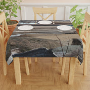 Tablecloth with a nature print featuring driftwood and water.