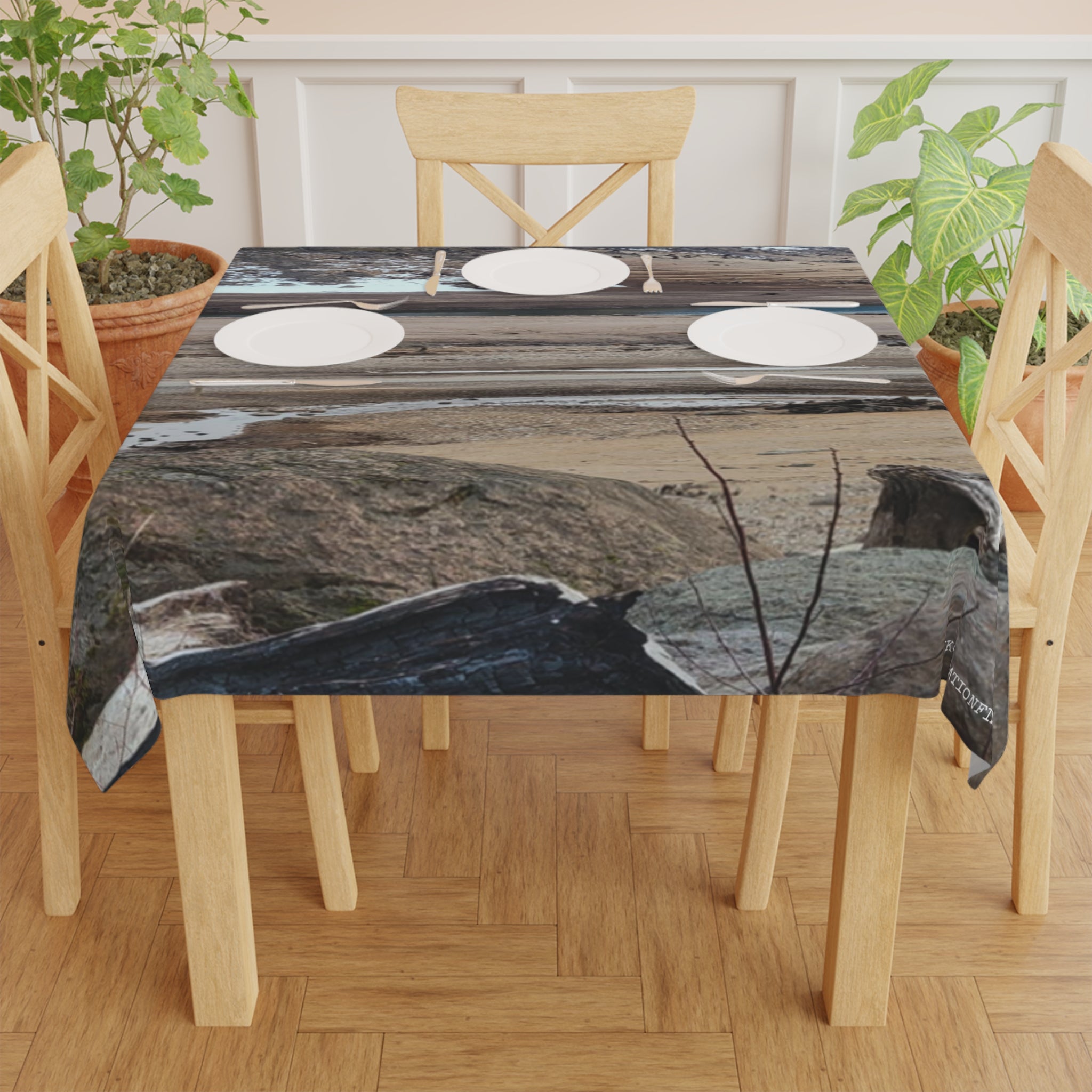 Tablecloth with a nature print featuring driftwood and water.