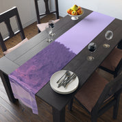 Lavender table runner with textured purple pattern on a wooden dining table.