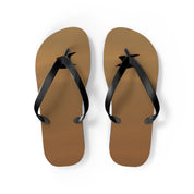 Brown flip-flops with black straps on a white background.
