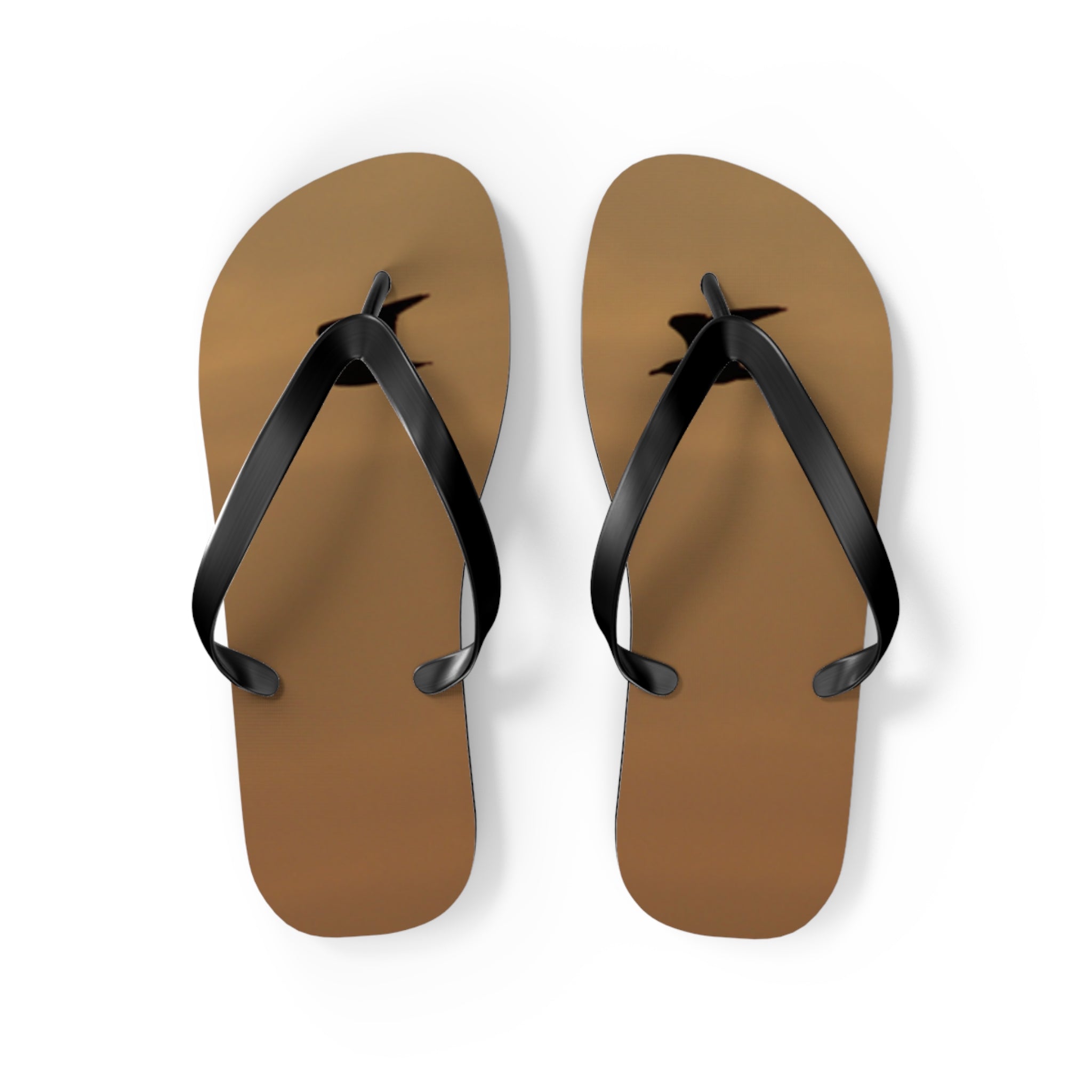 Brown flip-flops with black straps on a white background.