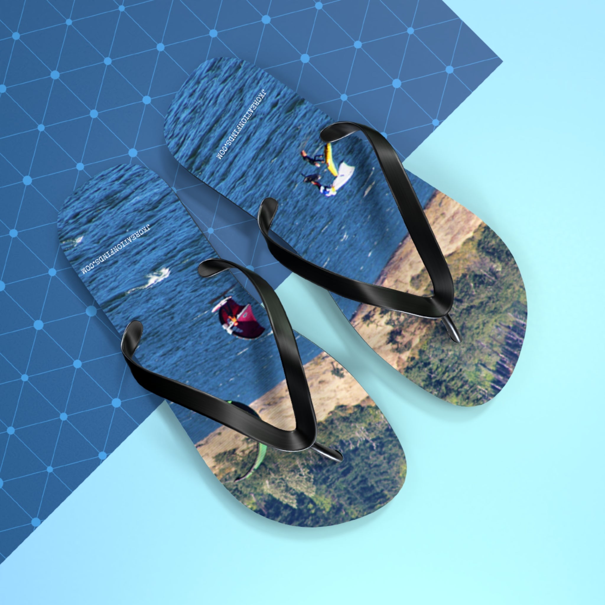 Flip-flops with images of kite surfers near a cliffside.