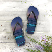 Flip-flops with ocean waves and stars design on a wooden background.