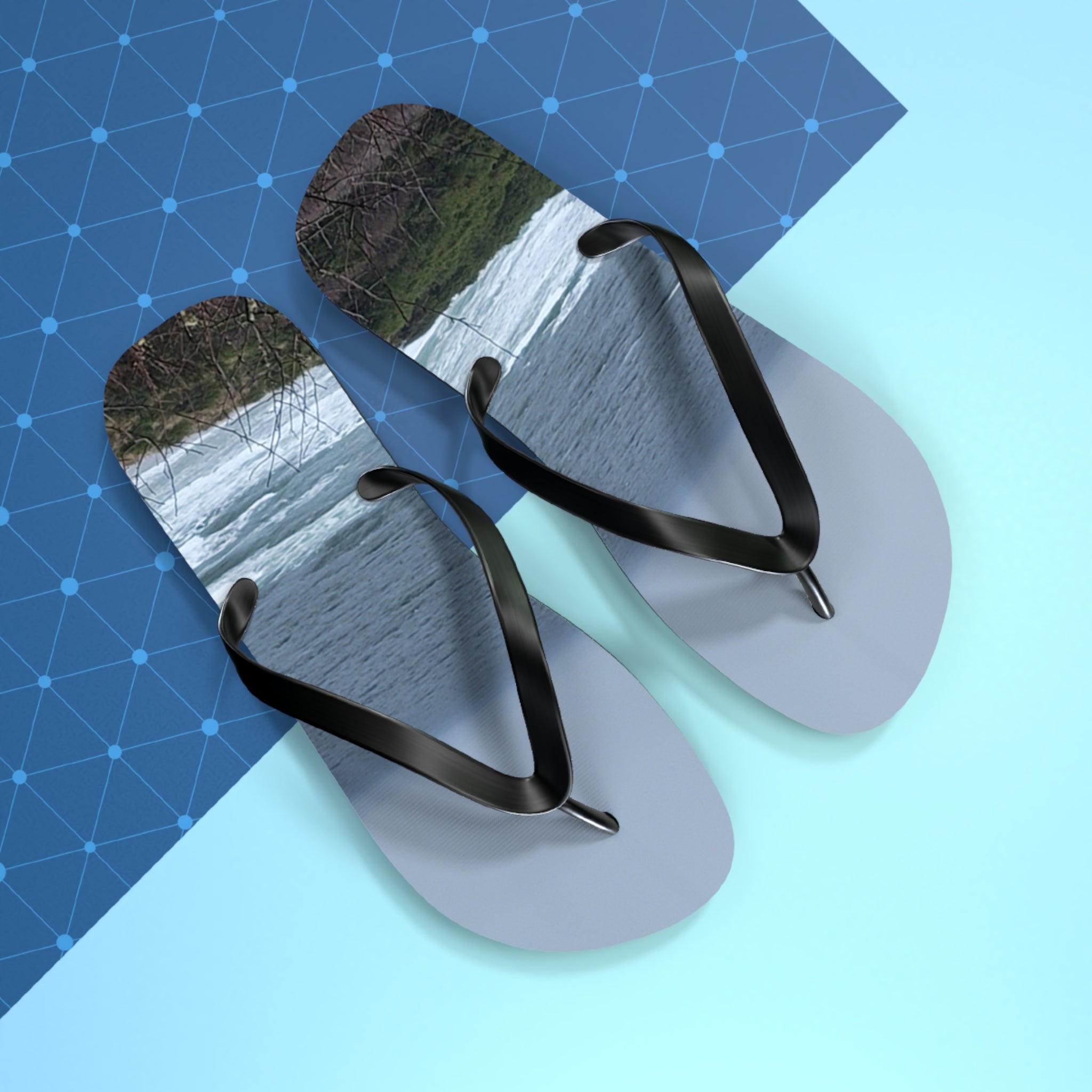 Flip-flops with an image of a waterfall on the soles.